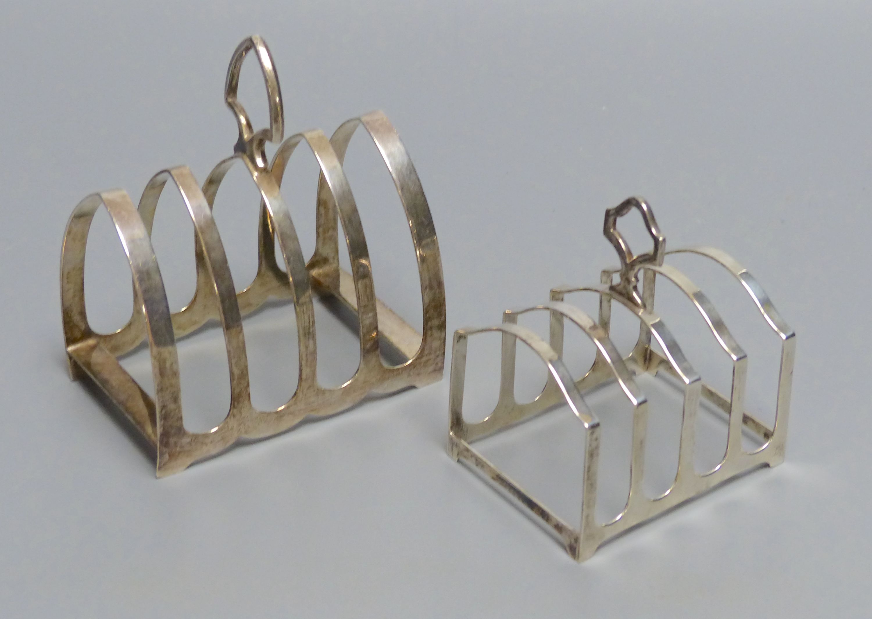 A Gothic design silver four division toast rack , 76mm and another smaller four-division toast rack, 5oz.